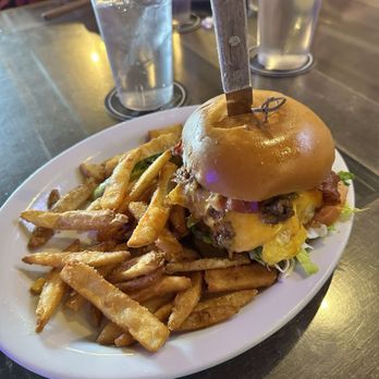 The Walrus signature dishes  Walrus Burger, Fish and Chips, various shareable appetizers, weekend brunch items.